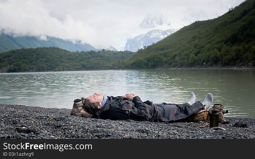 Man resting by Lake Mountain