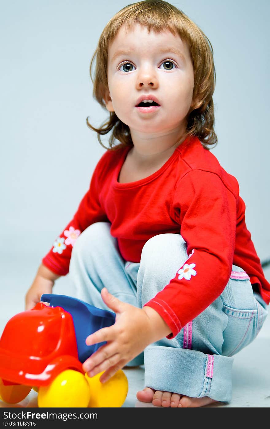 Beautiful little girl isolated on a white background