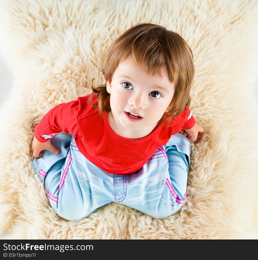 Beautiful little girl isolated on a white background