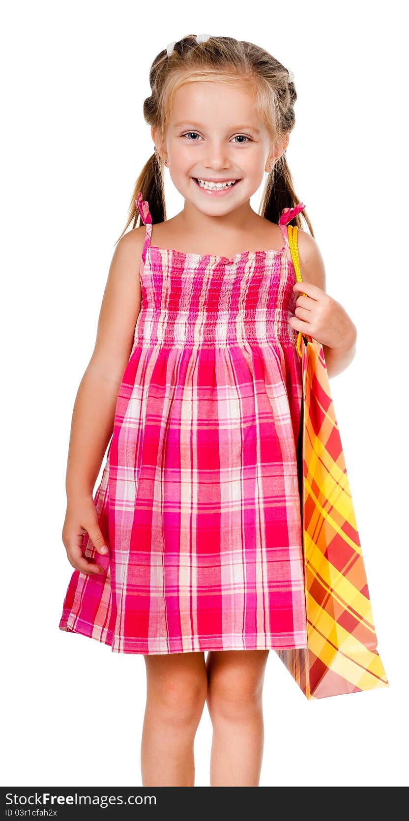 Little girl with the package isolated on a white background