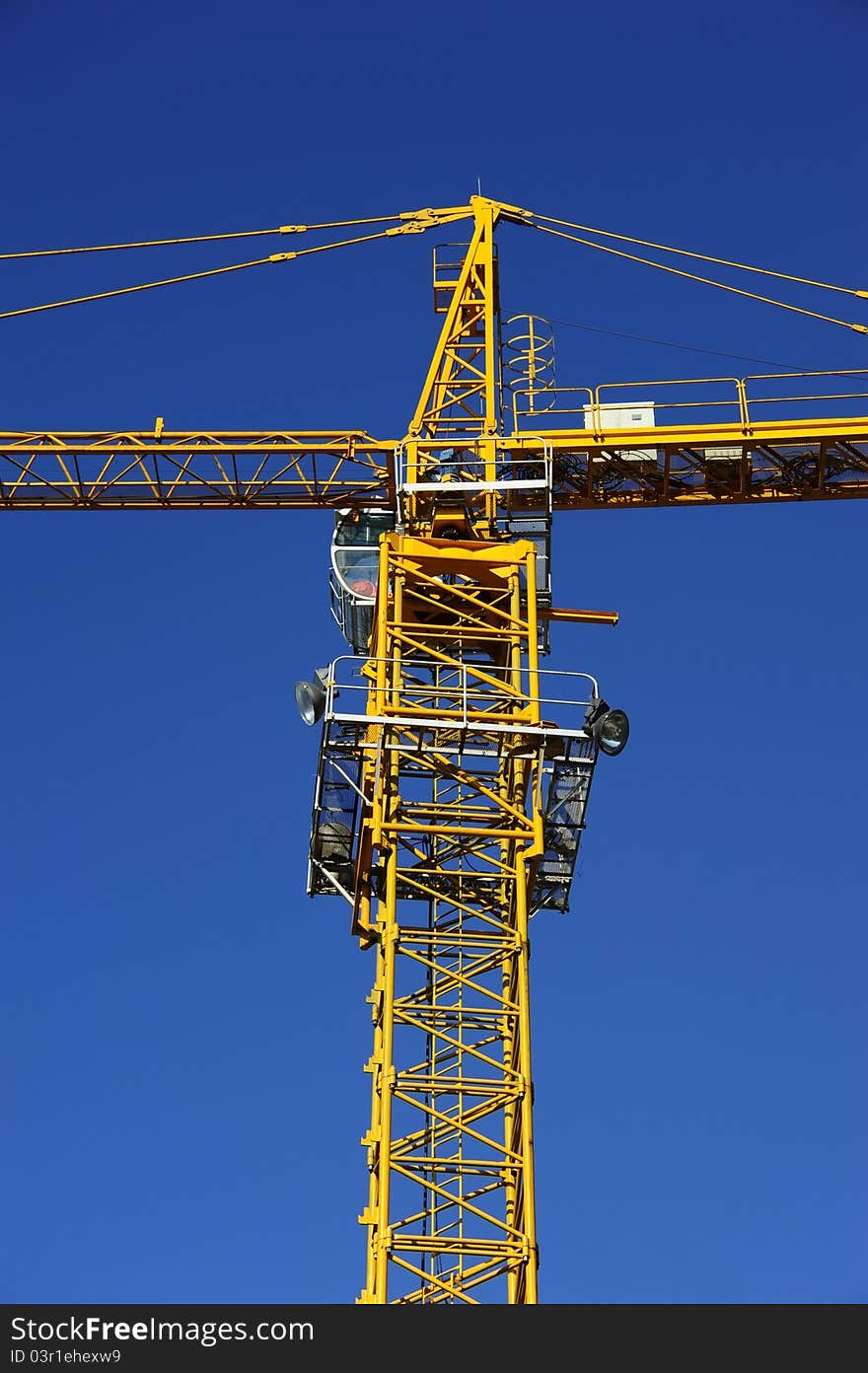 Tower crane in the blue sky