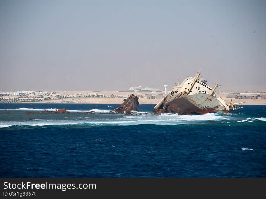 A shipwreck on a reef in the ocean, Egypt. A shipwreck on a reef in the ocean, Egypt