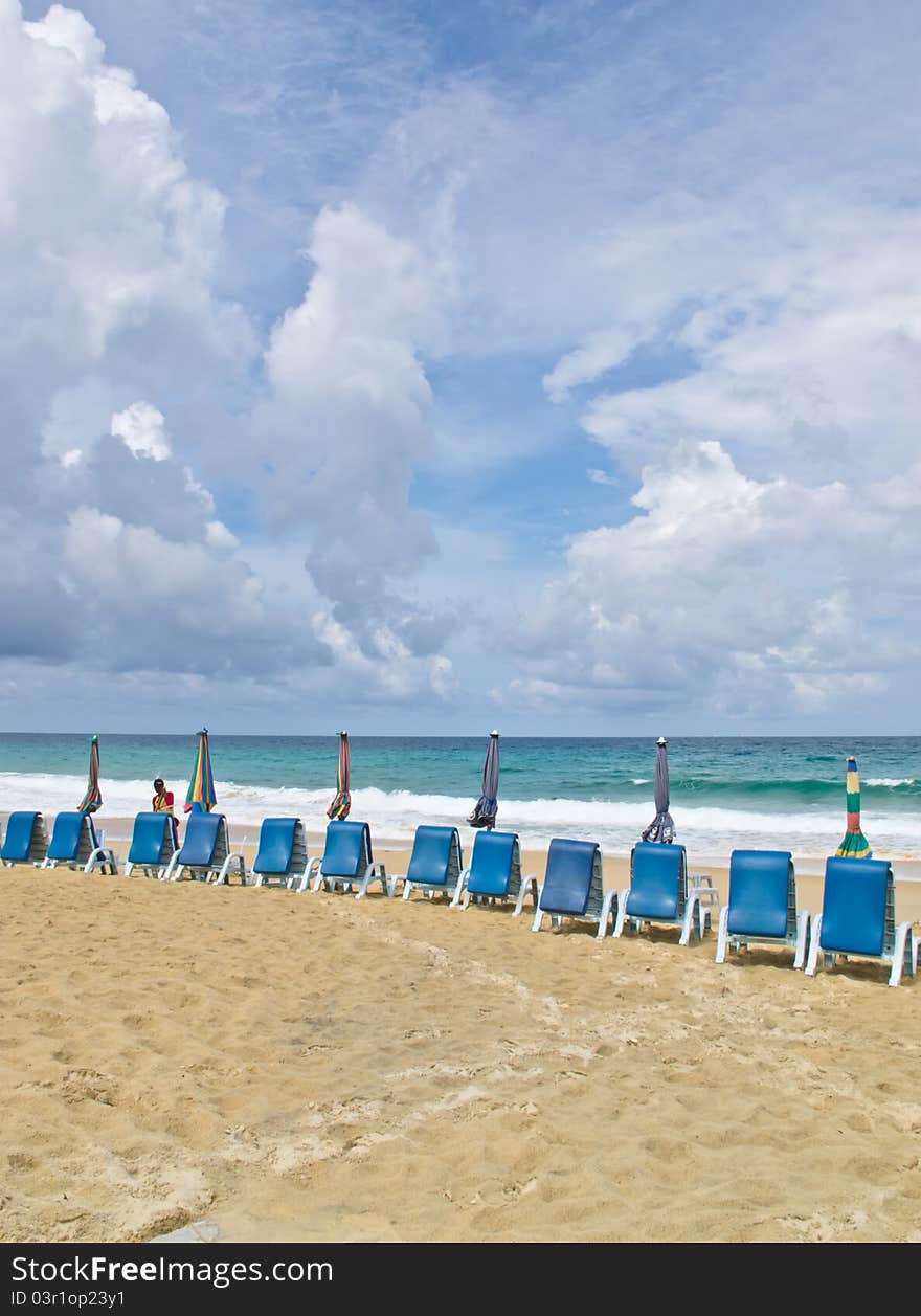 Beach chairs and  umbrella on beach. Beach chairs and  umbrella on beach