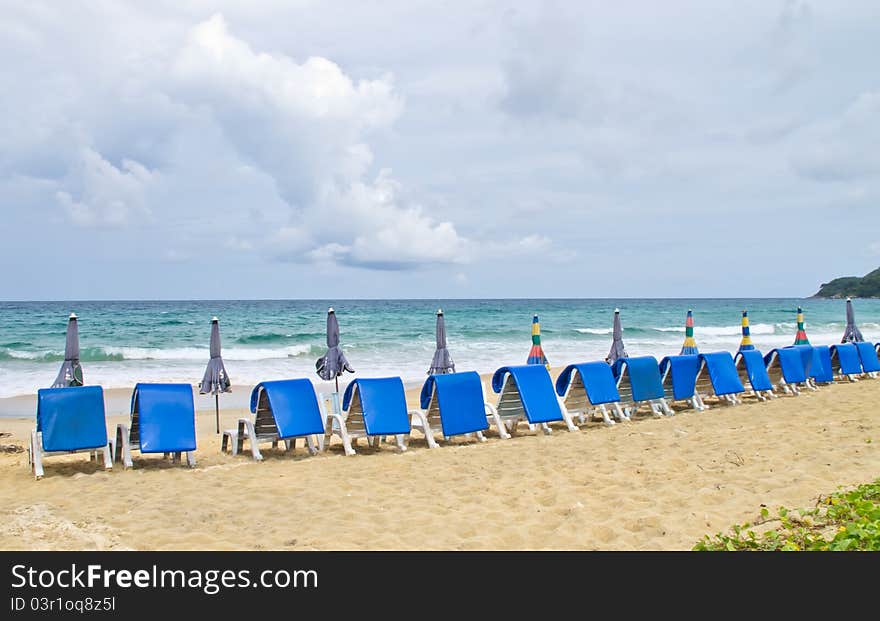 Beach chairs and  umbrella on beach. Beach chairs and  umbrella on beach