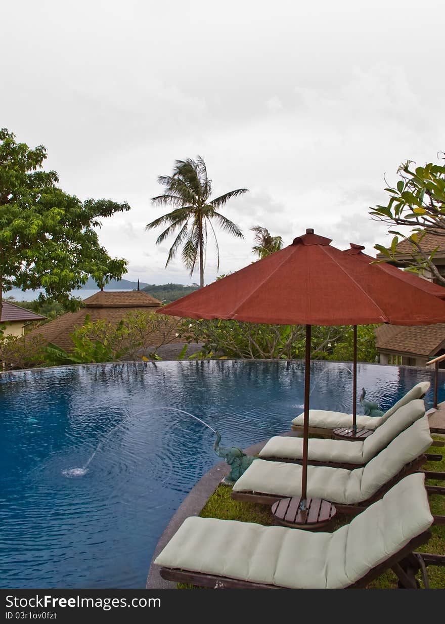 Beach chairs and umbrella on swiming pool. Beach chairs and umbrella on swiming pool