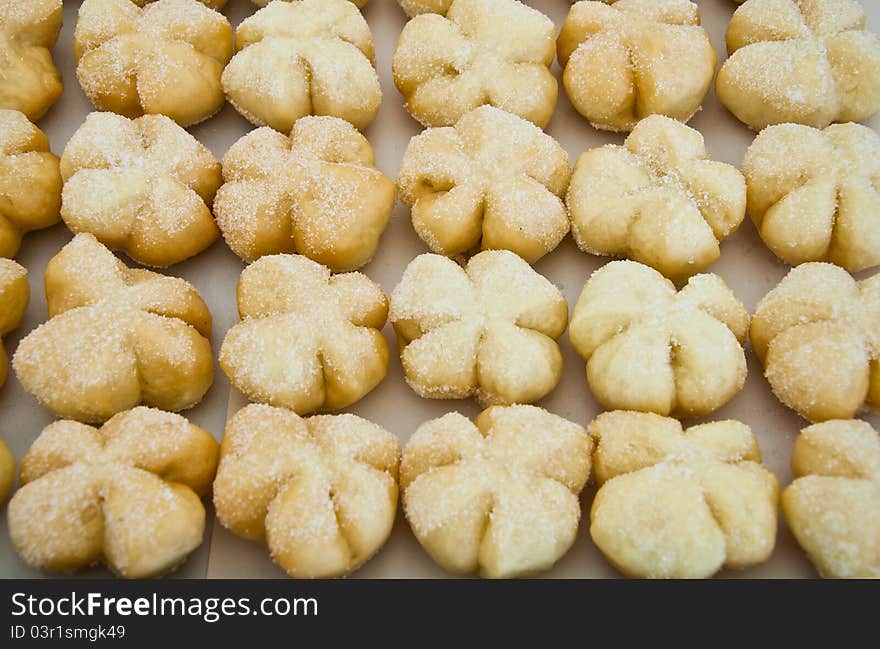 Row of fancy bread with sugar surface for sale and marketing