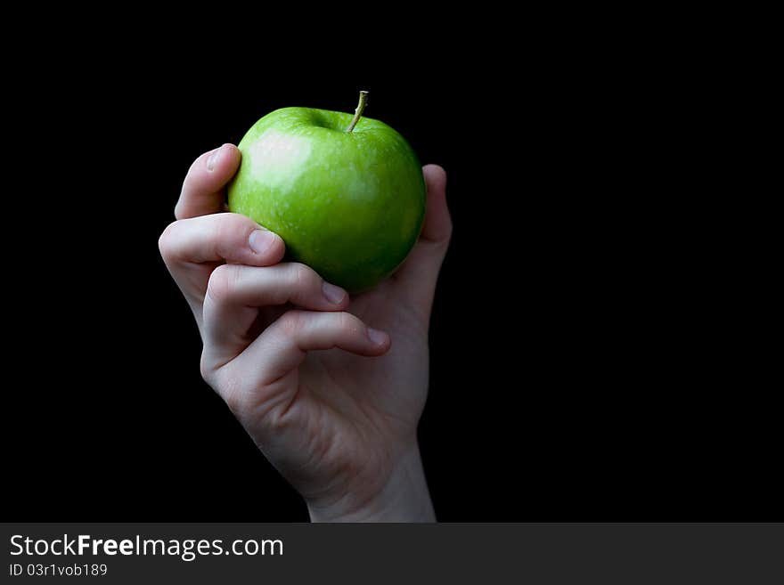 Hand holding a green apple. Hand holding a green apple.