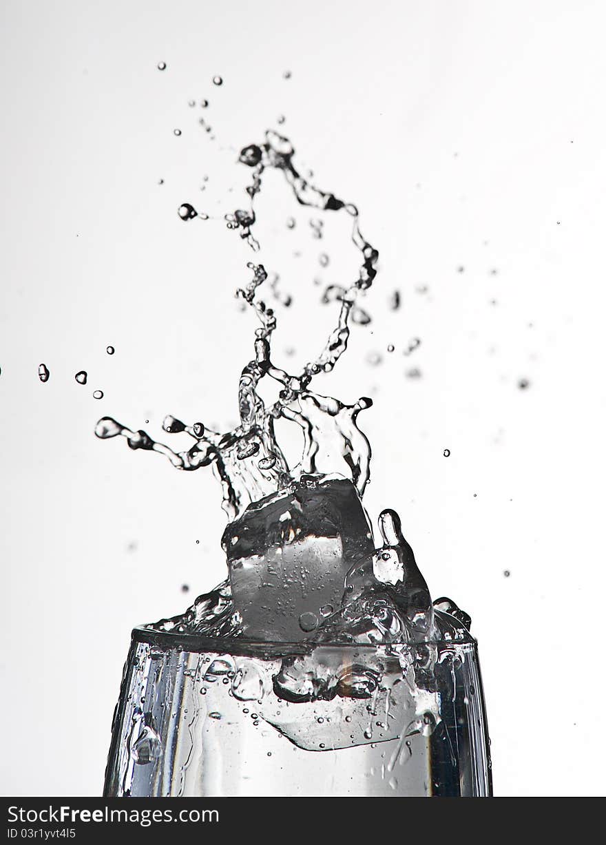 Falling ice in a water glass