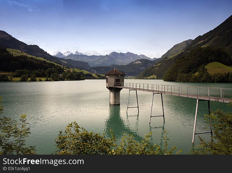 Lake in Switzerland with bridge and water tower. Lake in Switzerland with bridge and water tower