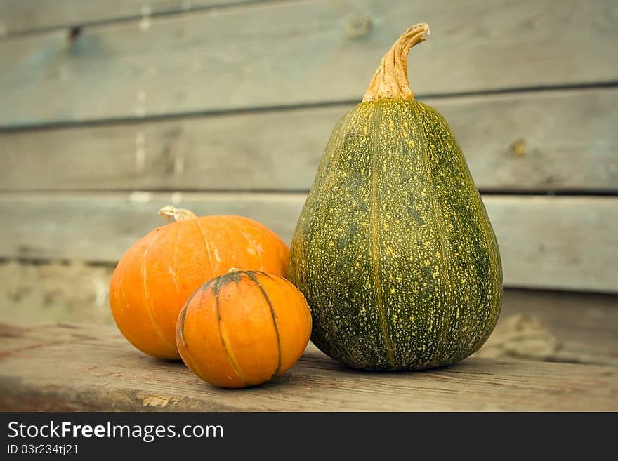 Pumpkins on a wooden background