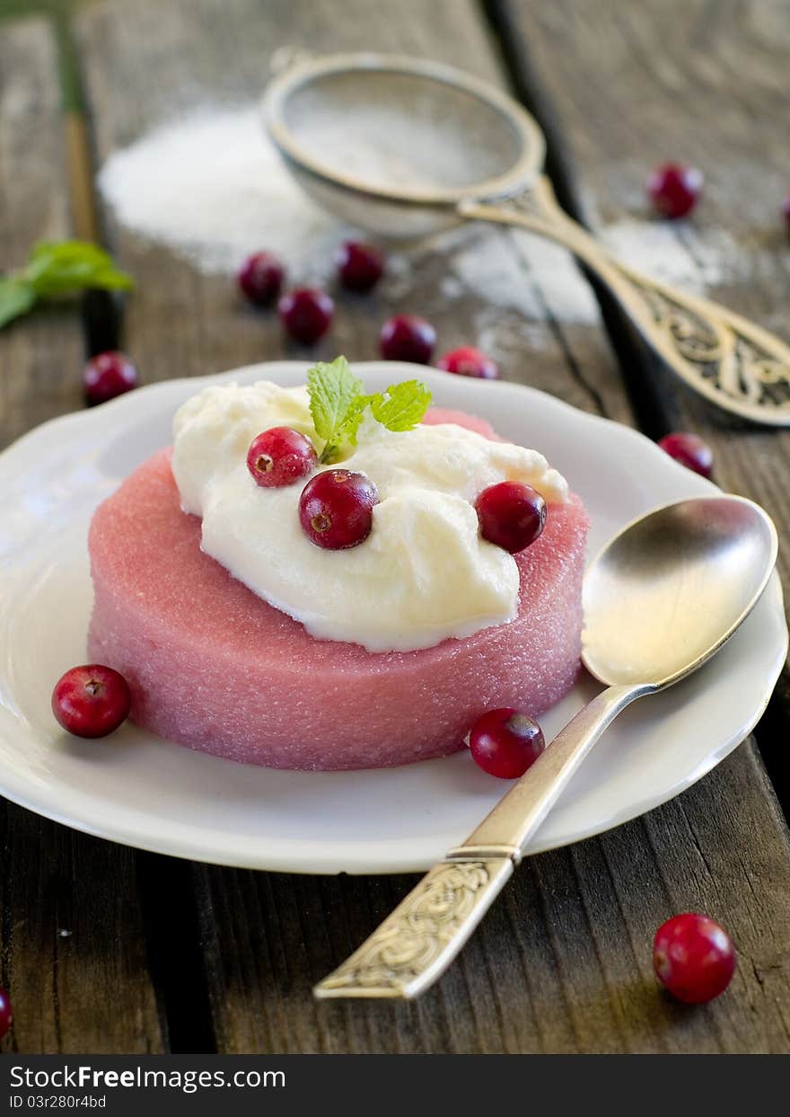 Delicious dessert with sweet cream and fresh berries. Selective focus