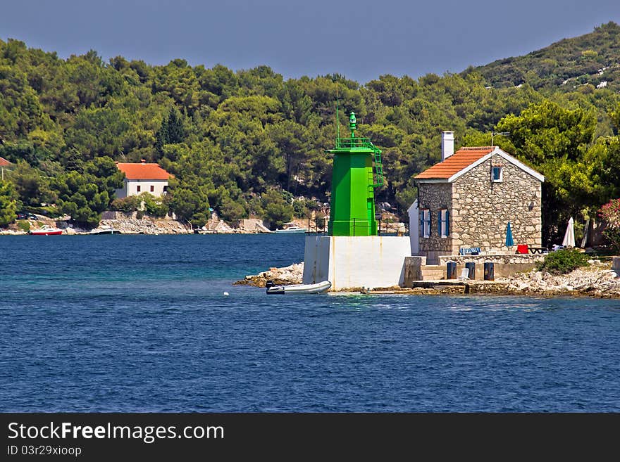 Green lighthouse - lantern in bay entrance, Mali Losinj, Croatia