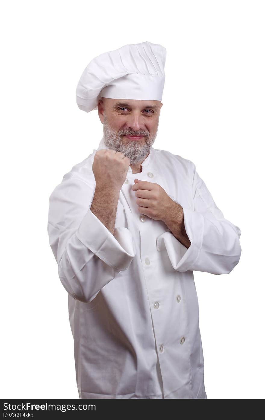 Portrait of a chef in a fighting stance in a chef's hat and uniform isolated on a white background.