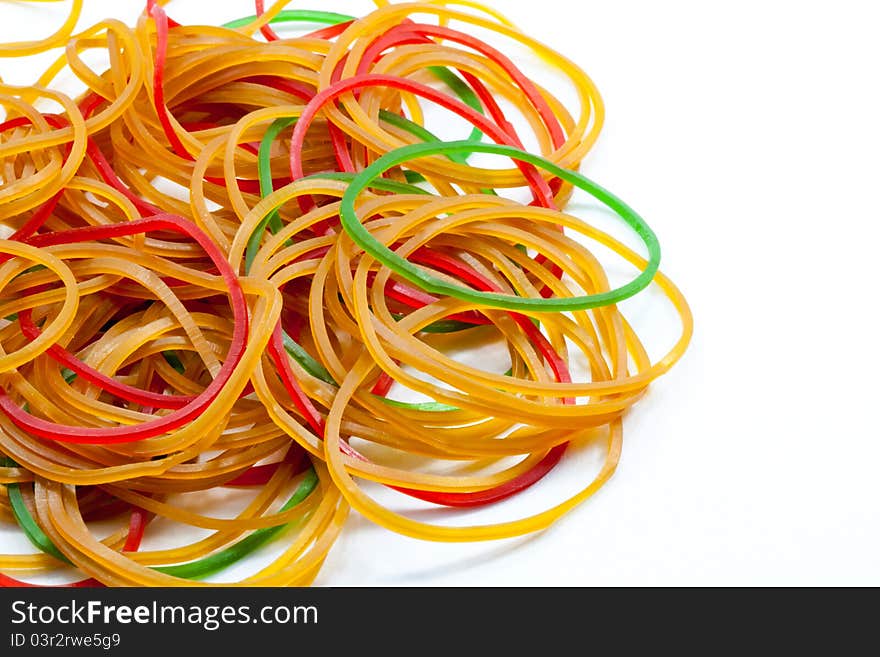 A pile of rubber bands on white background