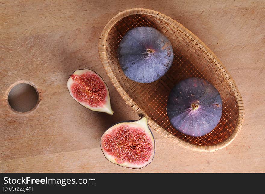 Slice fig on wood background. Slice fig on wood background