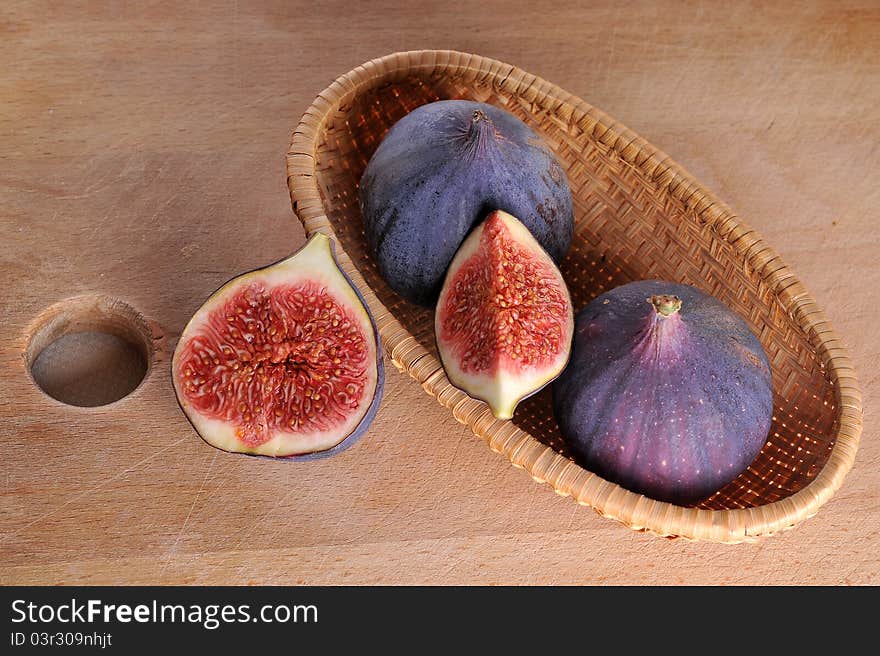 Slice fig on wood background. Slice fig on wood background