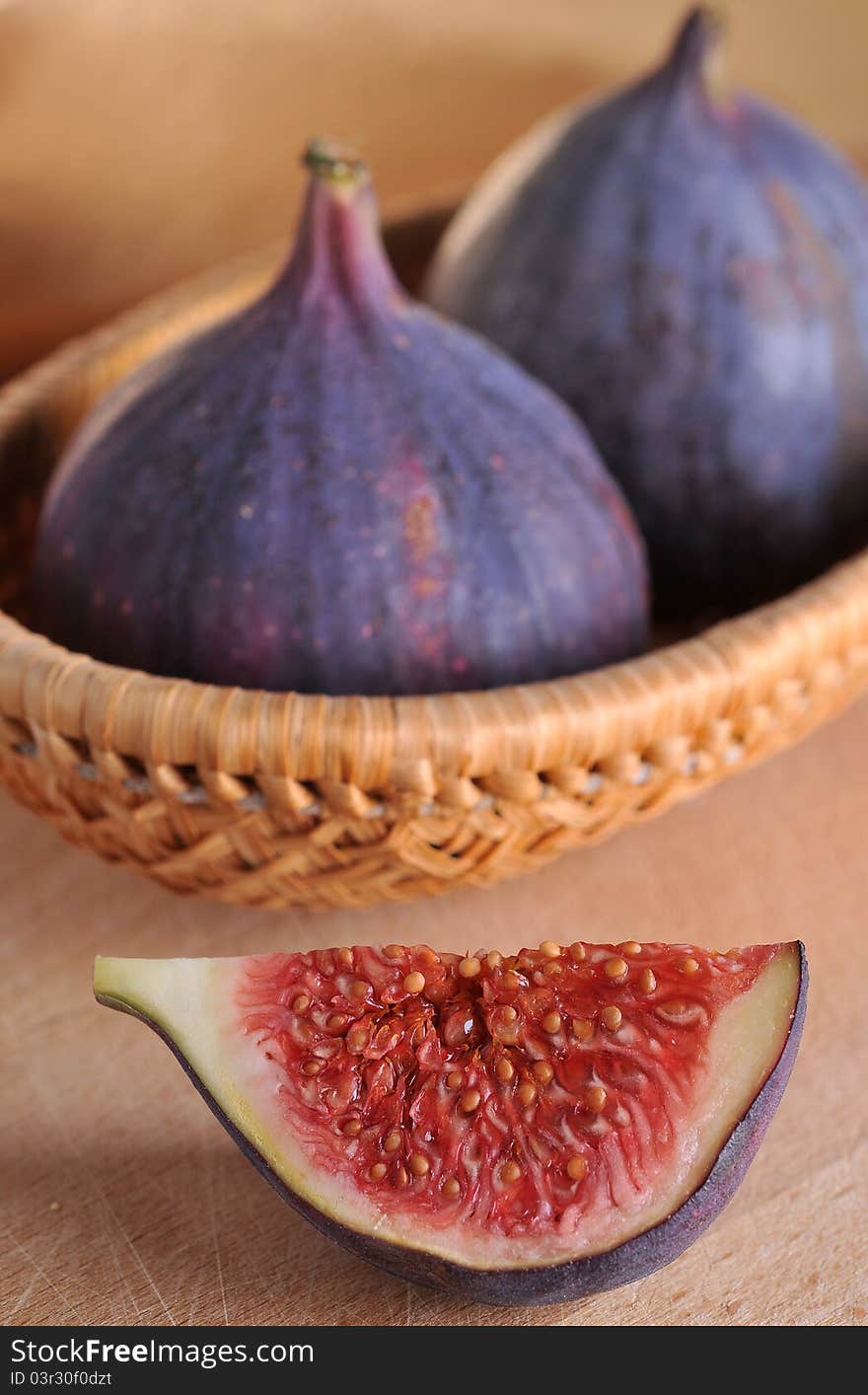 Slice fig on wood background. Slice fig on wood background