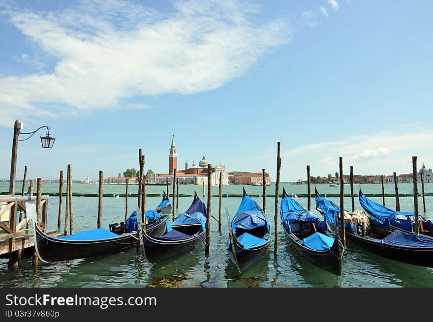 Anchored gondolas at sunny day