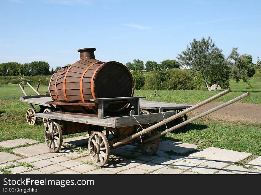 Old wooden barrel on cart