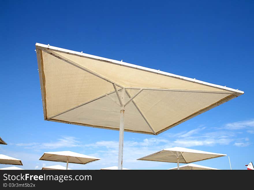 Beach umbrella in blue sky