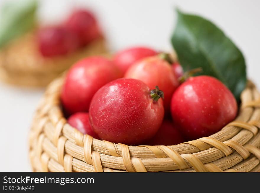 Small red apples in the basket