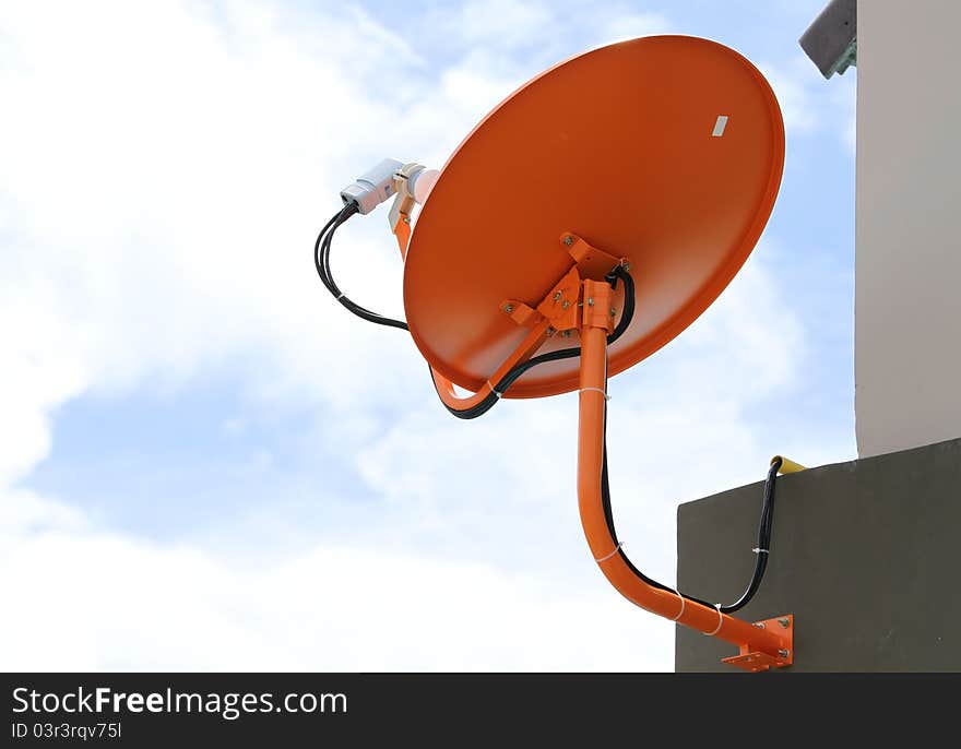 Satellite dish antenna on blue sky background