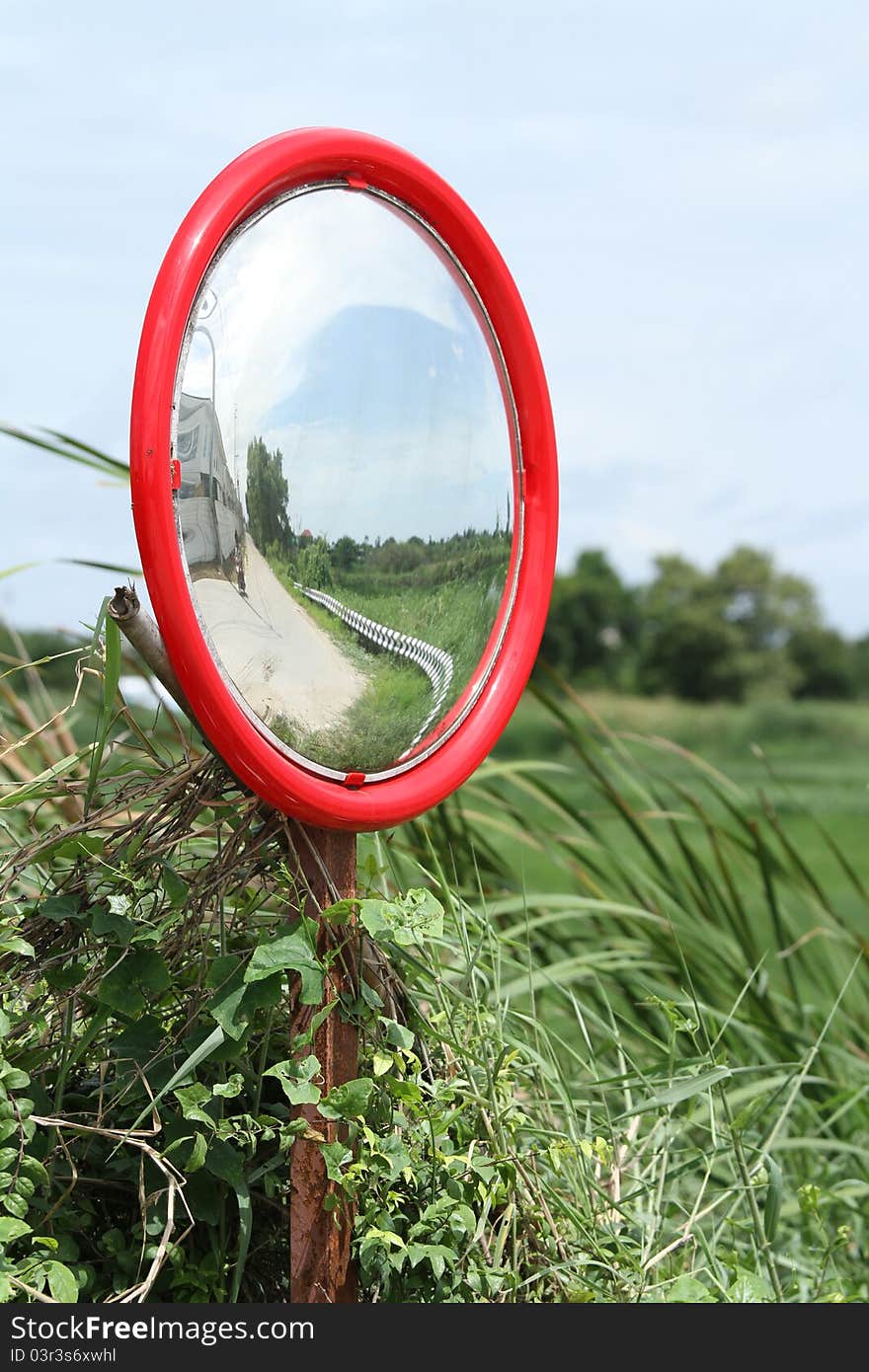 Security convex mirror reflecting on the road