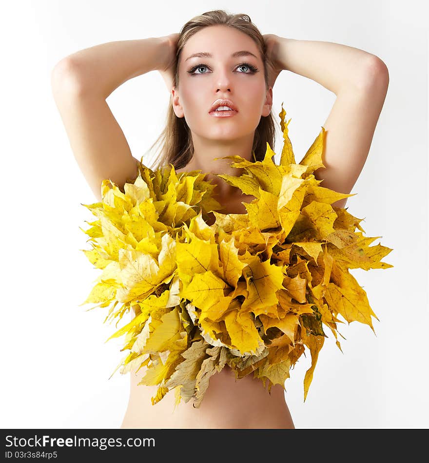 A girl with a wreath of autumn leaves. A girl with a wreath of autumn leaves.