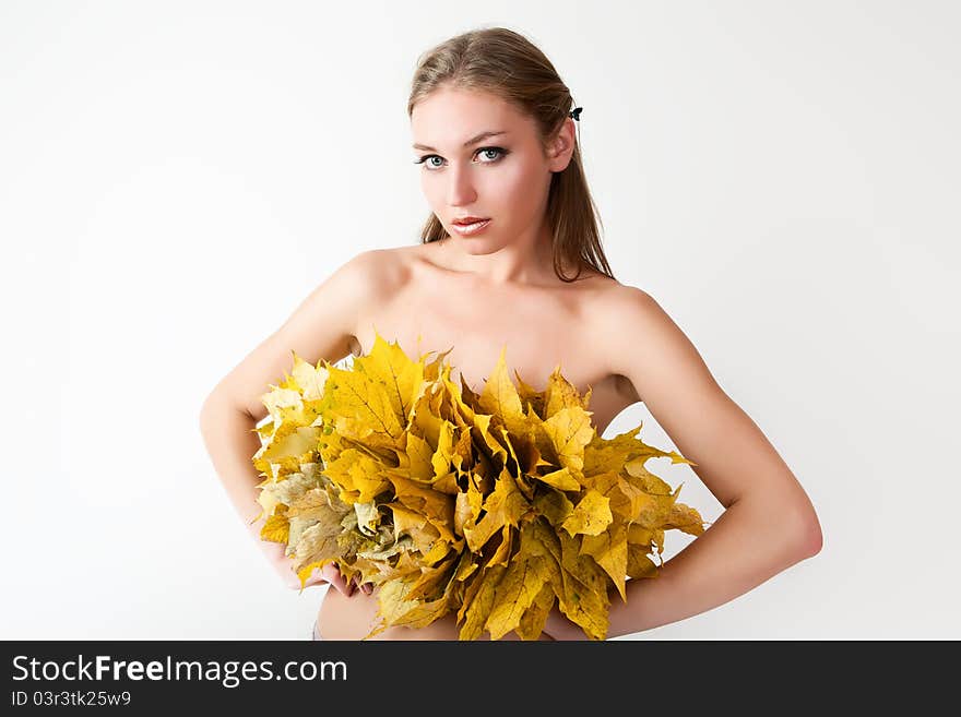 A girl with a wreath of autumn leaves. A girl with a wreath of autumn leaves.