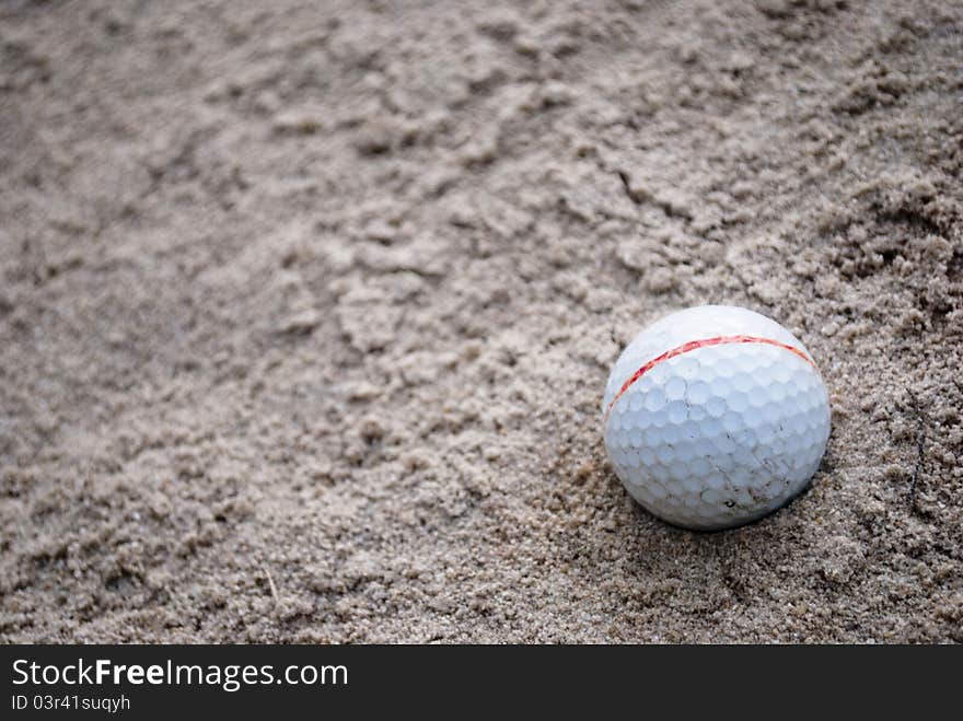 Golf ball on sand