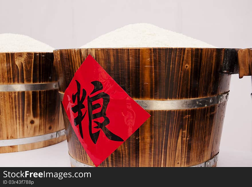 Close-up shot of a white rice in Wood container. Close-up shot of a white rice in Wood container