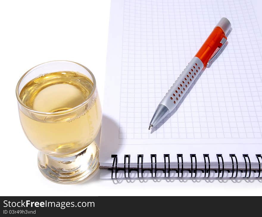 Color photo of glasses cup and empty notebook. Color photo of glasses cup and empty notebook