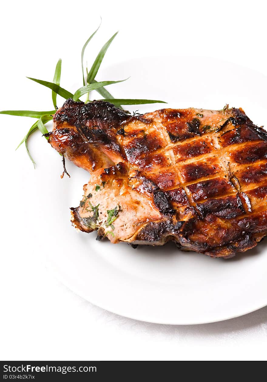 Grilled pork meat on white background