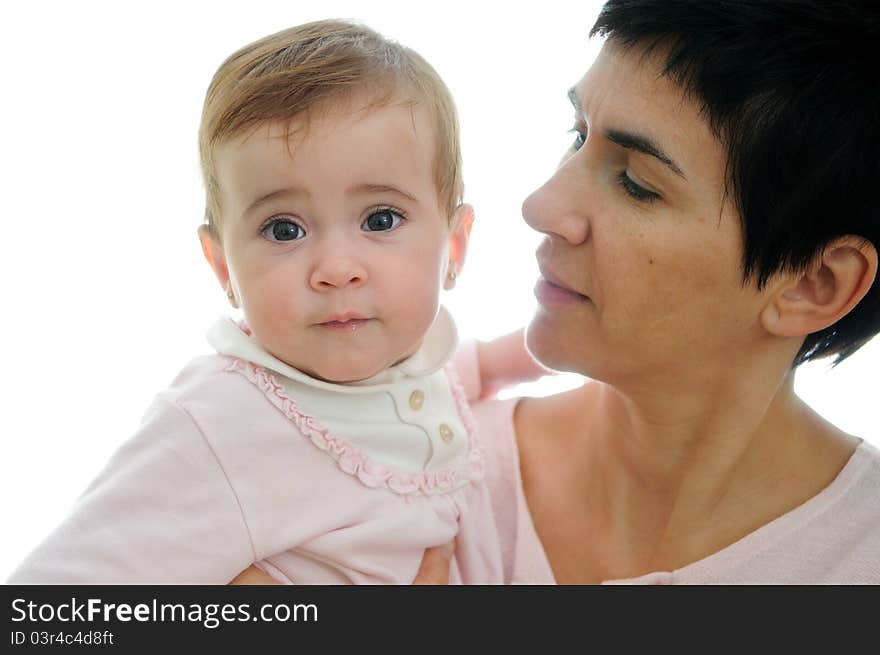 A mother playing with her little baby on white background. A mother playing with her little baby on white background