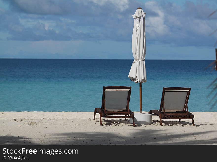 Seaside with two deck chairs at Maldives