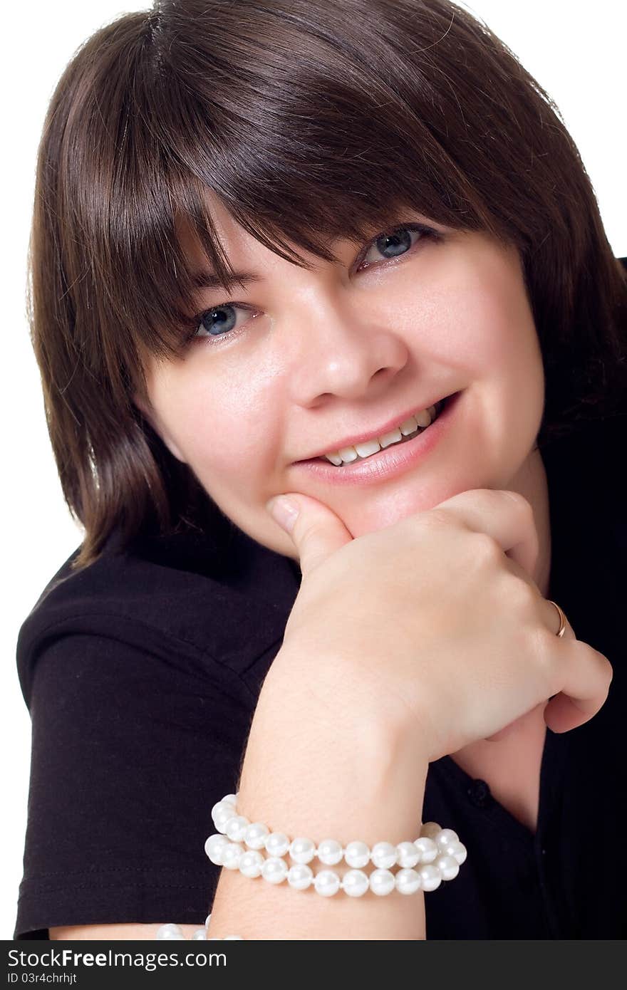 Smiling woman with pearl neacklace isolated over white