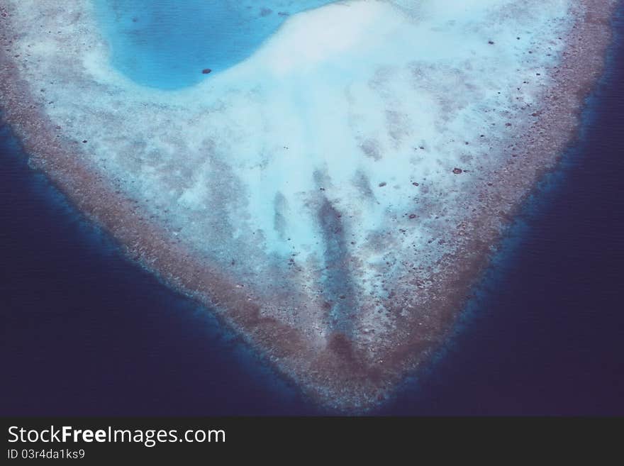 Heart shaped coral reefs birdview, Maldives