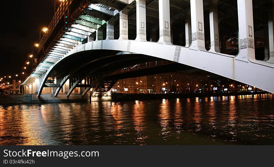 Moscow River, Andreyevsky Bridge in the light of night colored lights. Moscow, Russia