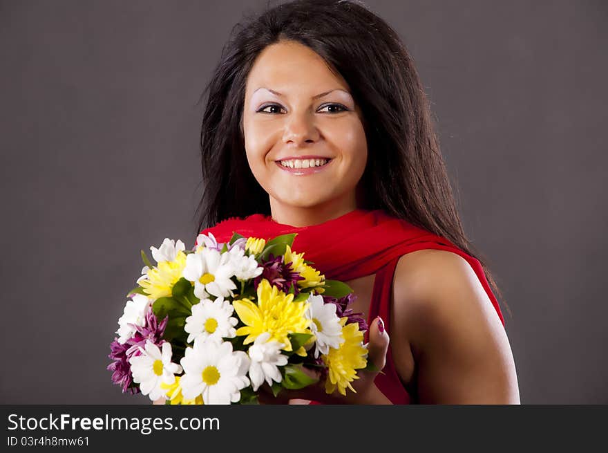 Beautiful girl with a big bouquet of wild flowers. Beautiful girl with a big bouquet of wild flowers