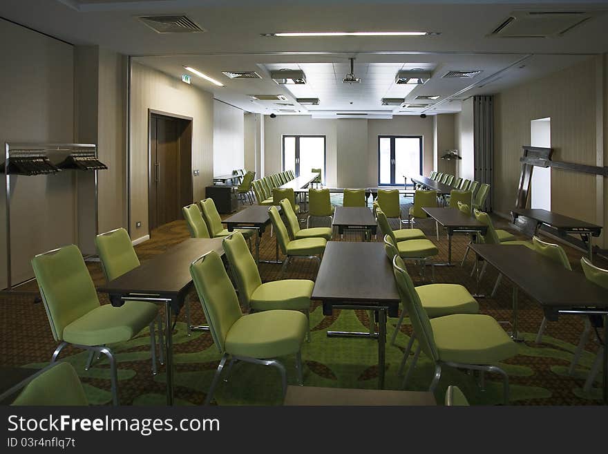 Room with many green chairs. Room with many green chairs