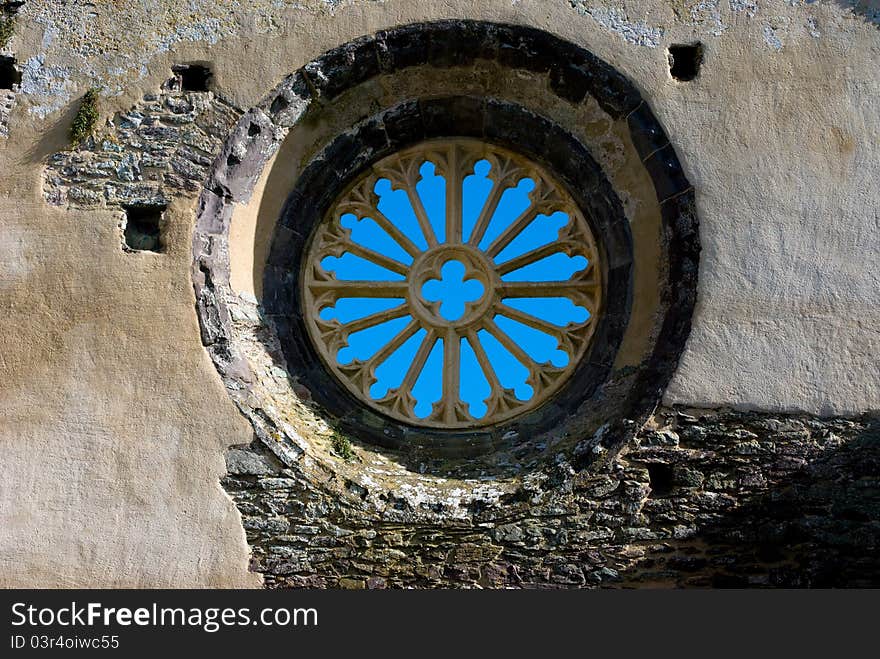 Blue sky through old window in ruined building