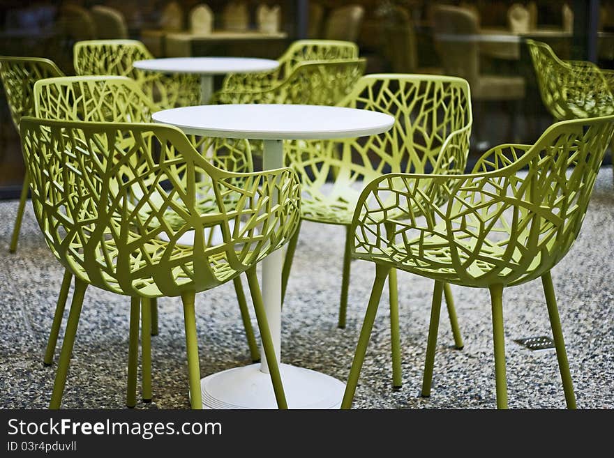 Terase with tables and green chairs. Terase with tables and green chairs