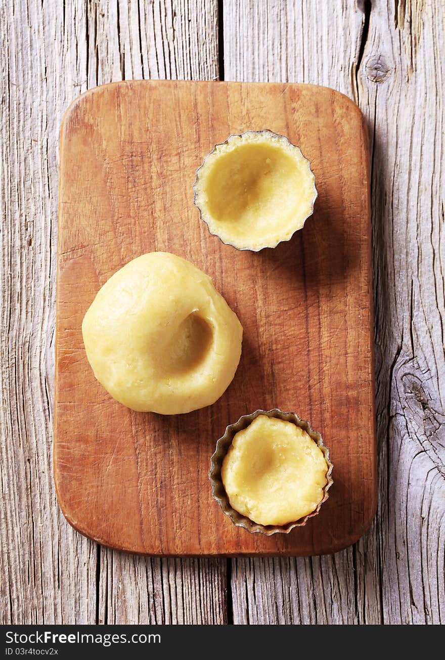 Raw Dough And Tartlet Pans