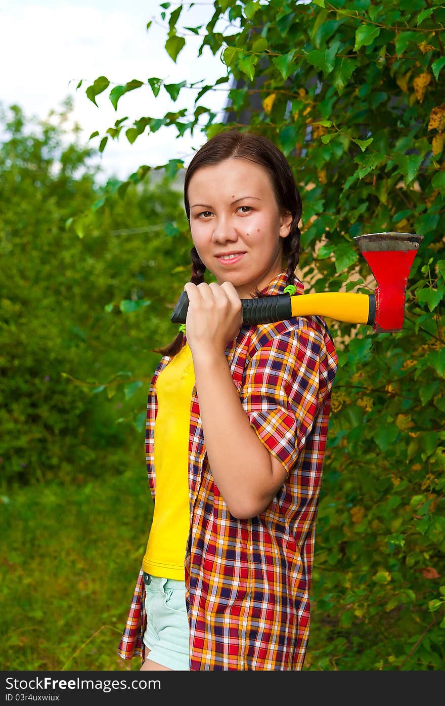 Young Woman Carrying An Axe