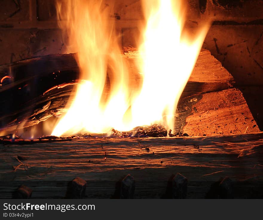 Close up of burning wood in a fire place.