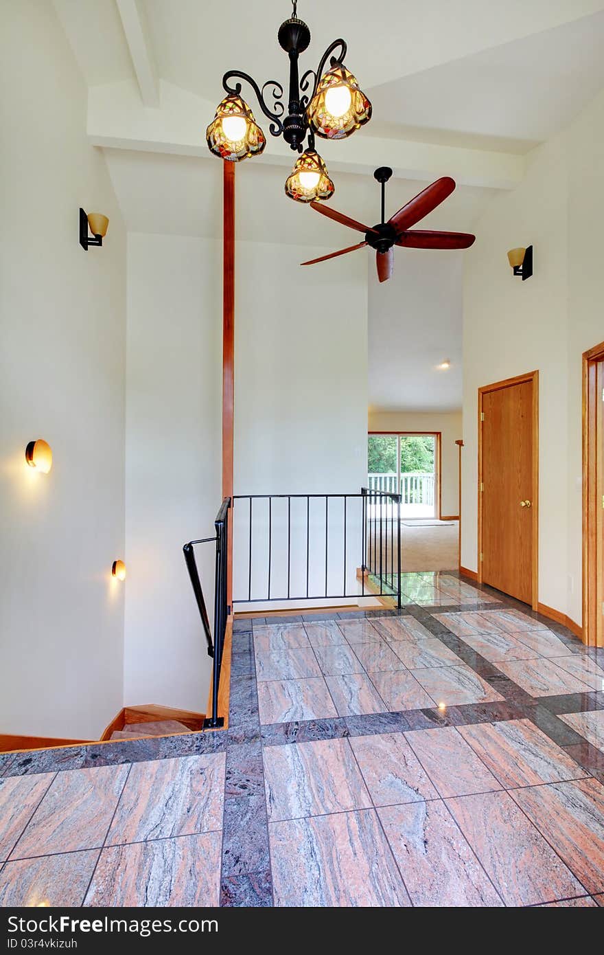 Entrance With Marble Floor And Staircase