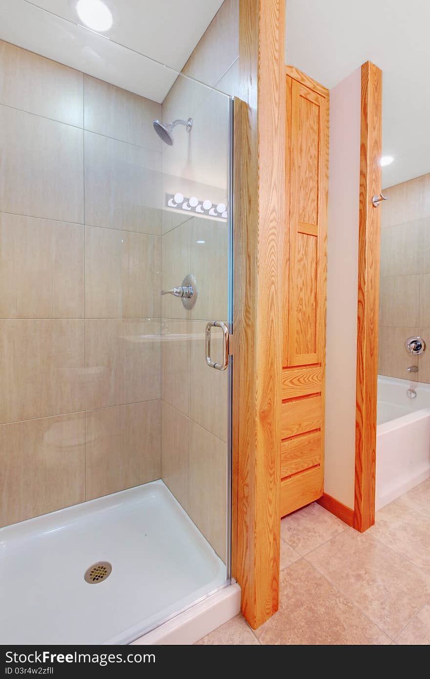 Shower and new bathroom with build in cabinets and tub. Shower and new bathroom with build in cabinets and tub.