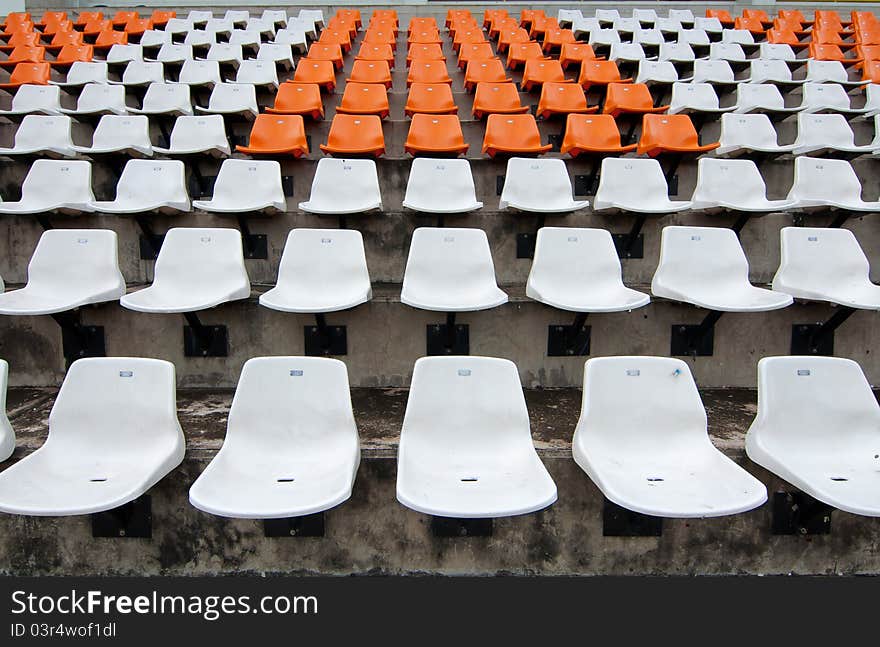 Front of the orange seats on the stadium