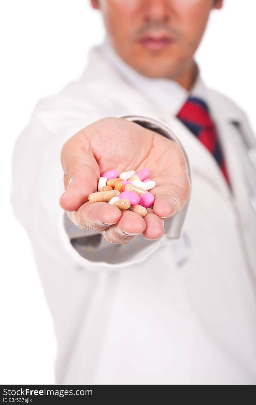 Doctor holding a lot of colorful pills