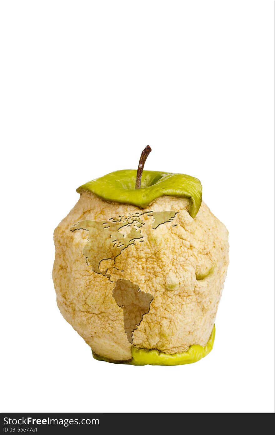 Decaying green Granny Smith apple with a silhouette of an earth isolated on a white background. Decaying green Granny Smith apple with a silhouette of an earth isolated on a white background.